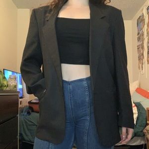 1980s faded black blazer with shoulder pads and interesting tag